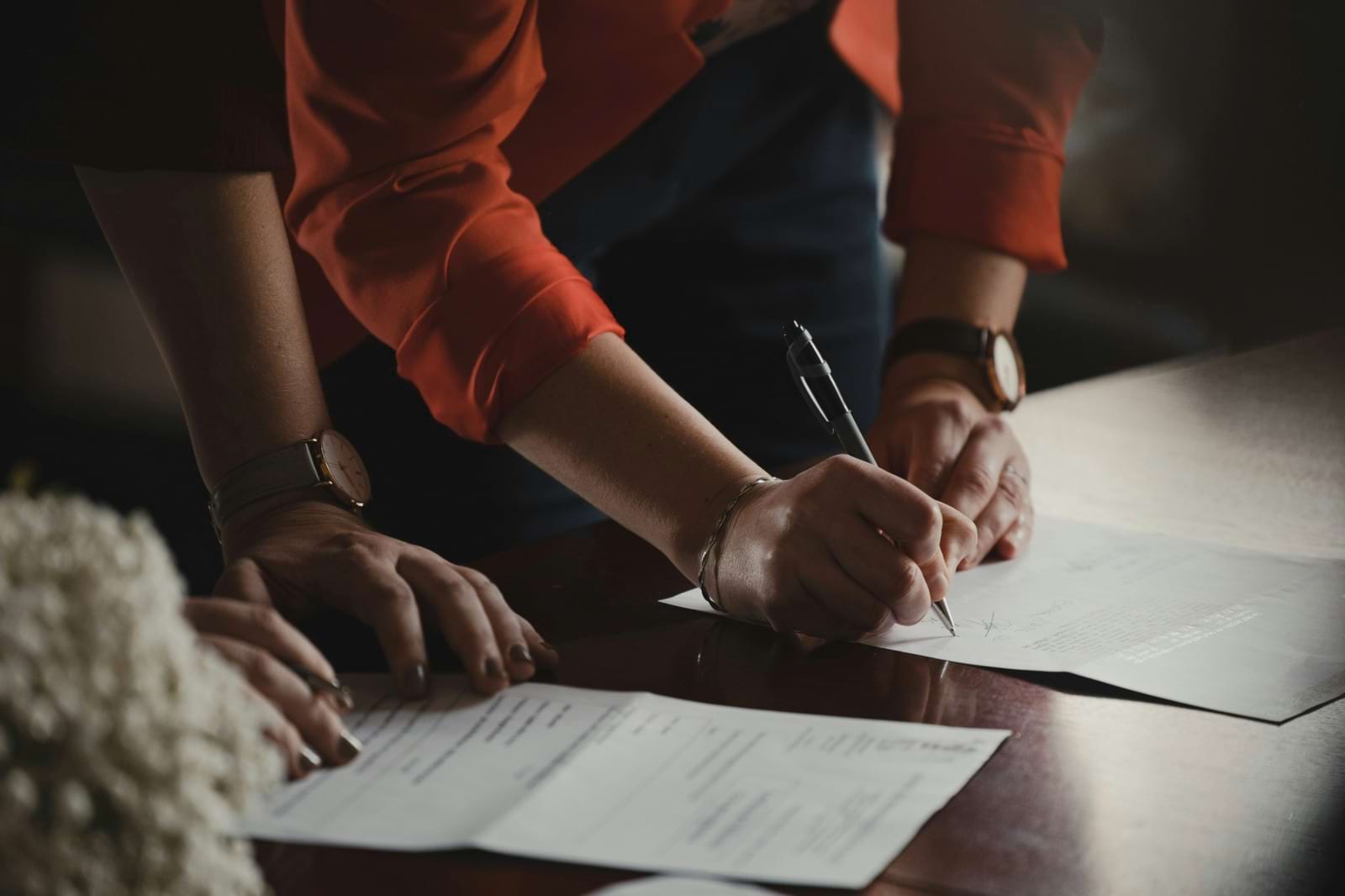 Couple signing papers