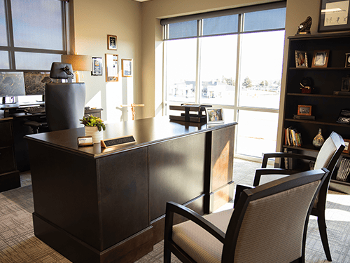 Desk inside the well-lit and sleek office of the Jackson branch