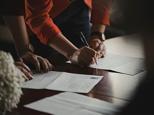 A family making a decision together to sign a legal document