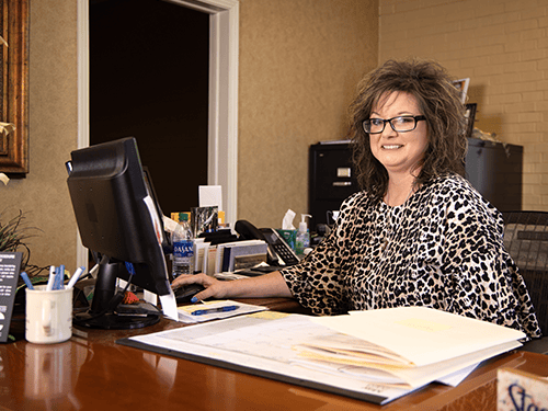 Officer of the Parsons' Branch at her desk, ready to work