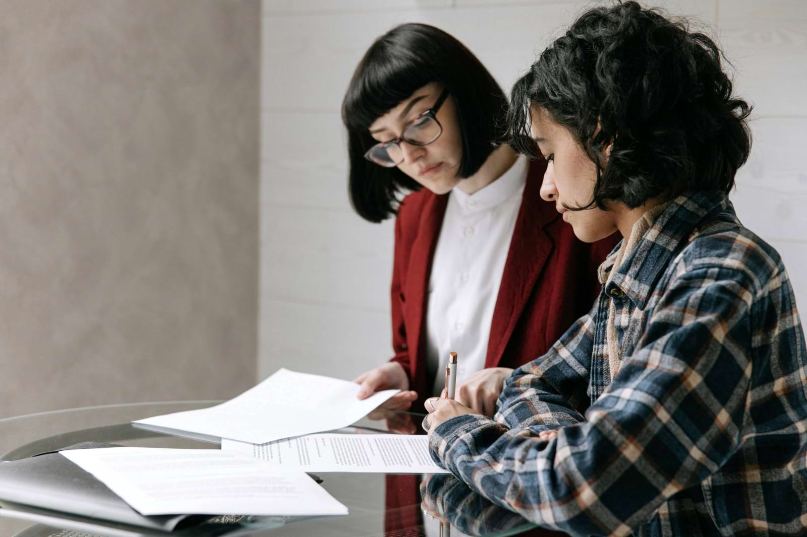 two ladies looking over loan options